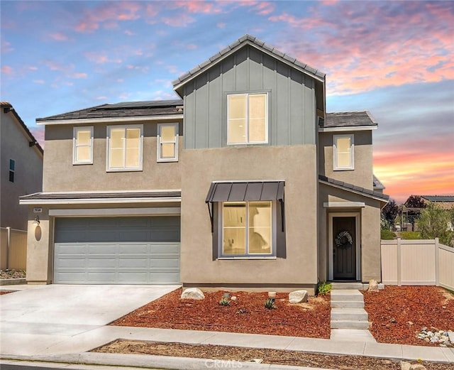 28508 Daybreak Way, Saugus, CA 91350 - traditional-style house featuring a garage, concrete driveway, stucco siding, and board and batten siding