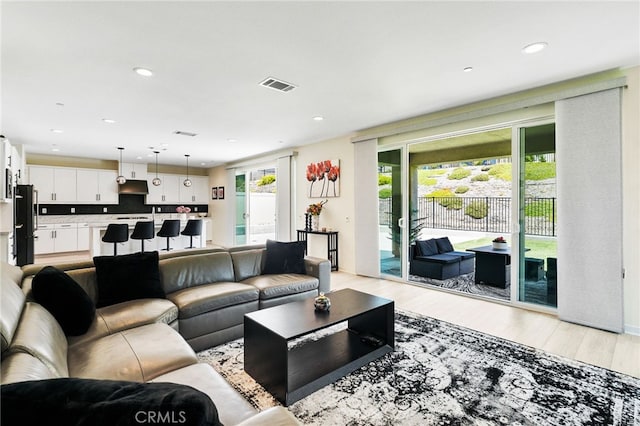 28508 Daybreak Way, Saugus, CA 91350 - living area with light wood-style flooring and recessed lighting