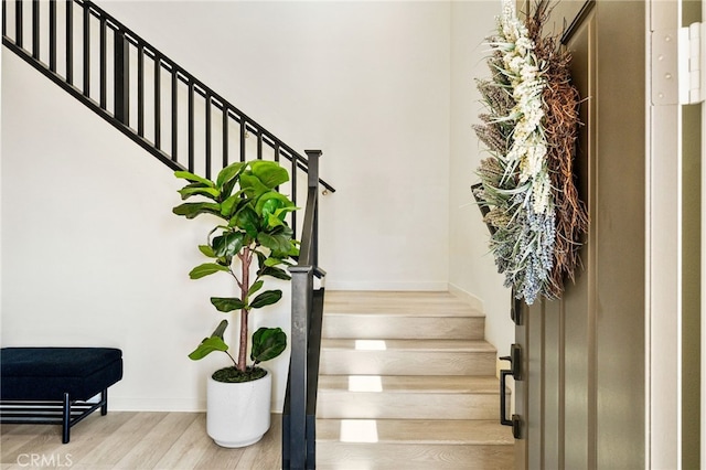 28508 Daybreak Way, Saugus, CA 91350 - staircase featuring wood finished floors and baseboards