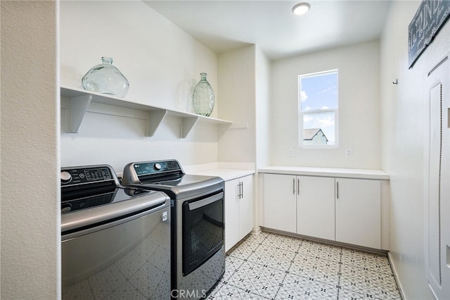 28508 Daybreak Way, Saugus, CA 91350 - laundry area featuring washing machine and dryer, cabinet space, and light flooring