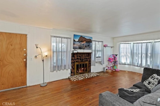 24976 7th St, San Bernardino, CA 92410 - living area featuring wood finished floors and a fireplace