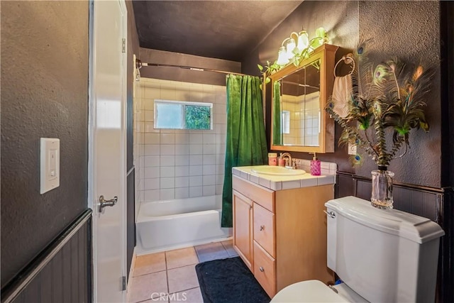 24058 Eagle Mountain St, West Hills, CA 91304 - bathroom featuring vanity, tile patterned floors, shower / bath combo with shower curtain, and a textured wall