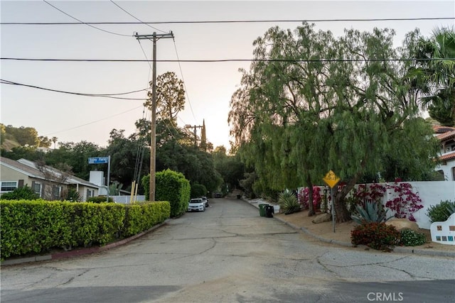 24058 Eagle Mountain St, West Hills, CA 91304 - view of asphalt road with curbs and traffic signs