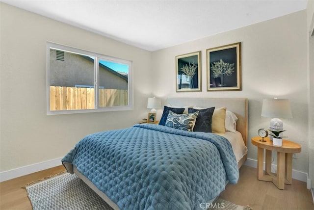10965 Canis Ln, San Diego, CA 92126 - bedroom with baseboards and wood finished floors