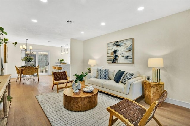 10965 Canis Ln, San Diego, CA 92126 - living area featuring light wood finished floors, a chandelier, and recessed lighting