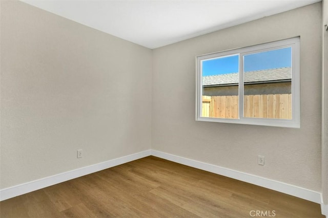 10965 Canis Ln, San Diego, CA 92126 - empty room with baseboards and dark wood-style flooring