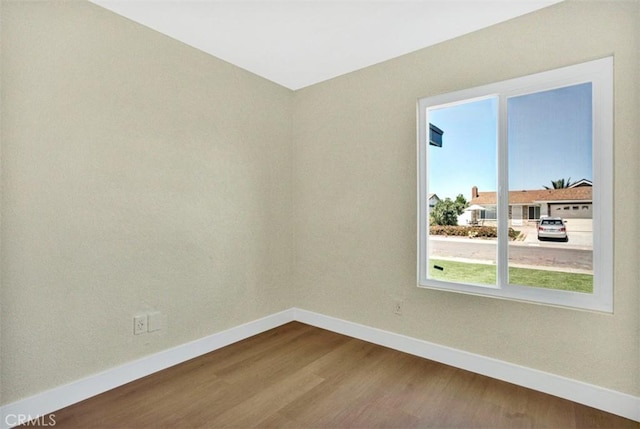 10965 Canis Ln, San Diego, CA 92126 - spare room with baseboards and dark wood-style flooring