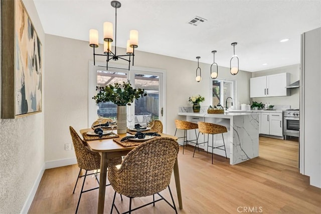 10965 Canis Ln, San Diego, CA 92126 - dining space with light wood-style flooring, a chandelier, and recessed lighting