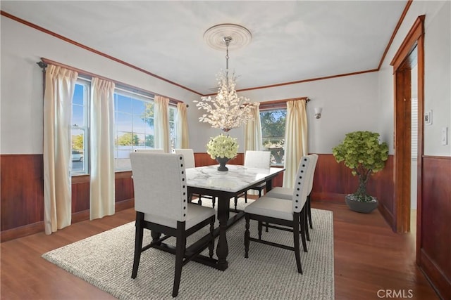 853 S Lemon St, Anaheim, CA 92805 - dining room with wainscoting, a chandelier, ornamental molding, wood finished floors, and wooden walls
