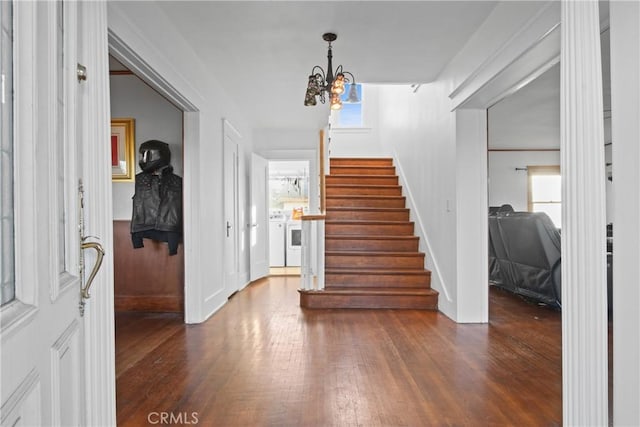 853 S Lemon St, Anaheim, CA 92805 - foyer with washer / dryer, stairs, dark wood finished floors, and a chandelier