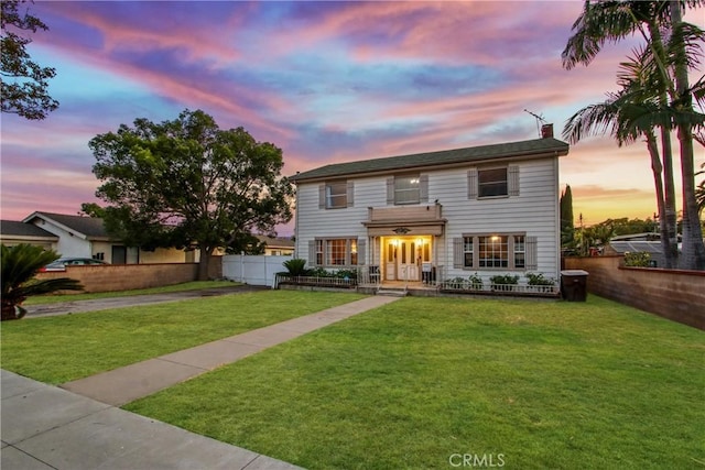 853 S Lemon St, Anaheim, CA 92805 - view of front facade with a chimney, driveway, and a garage