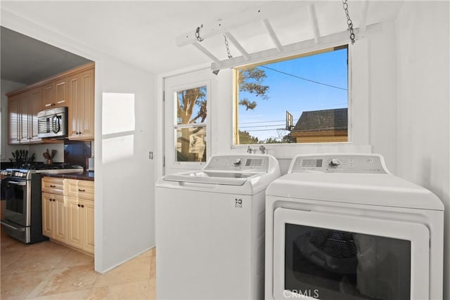 853 S Lemon St, Anaheim, CA 92805 - laundry area with separate washer and dryer and light tile patterned flooring