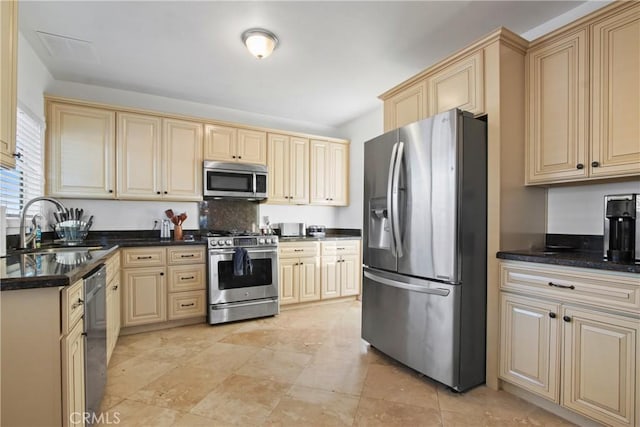 853 S Lemon St, Anaheim, CA 92805 - kitchen with appliances with stainless steel finishes and cream cabinets