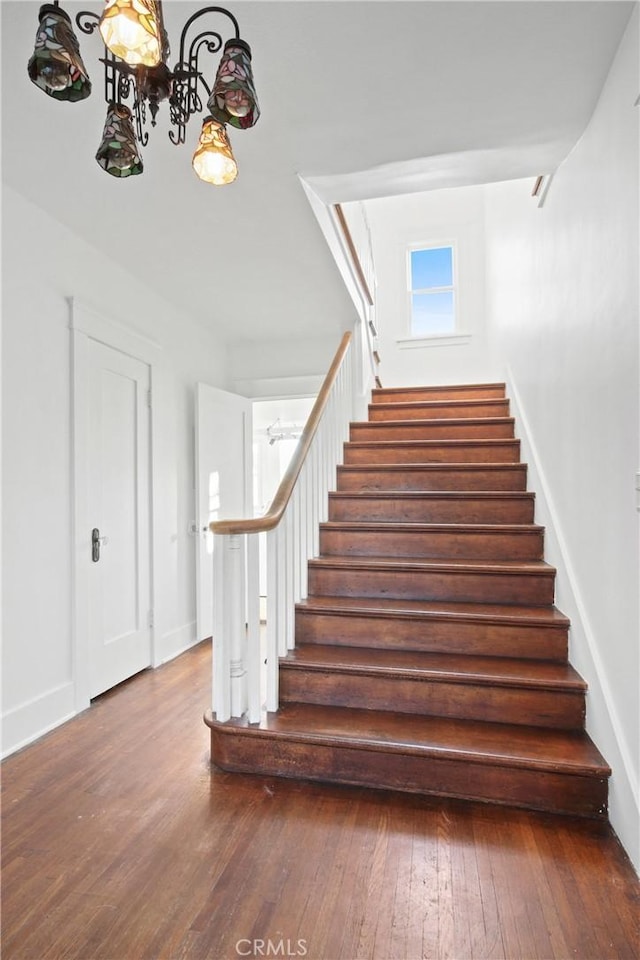 853 S Lemon St, Anaheim, CA 92805 - stairs featuring a chandelier and wood-type flooring