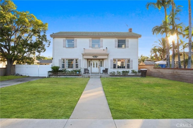 853 S Lemon St, Anaheim, CA 92805 - view of front of house with a chimney and french doors