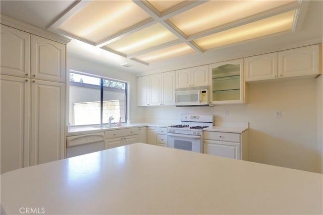 227 Gable Ln, La Habra, CA 90631 - kitchen with white appliances, glass insert cabinets, and white cabinets