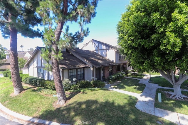 227 Gable Ln, La Habra, CA 90631 - tudor house with a front lawn and stucco siding