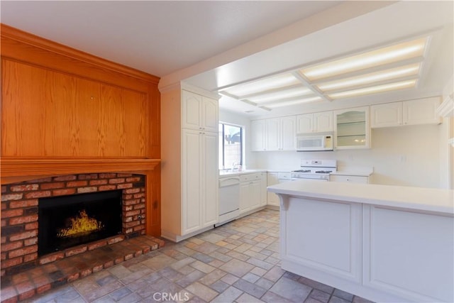 227 Gable Ln, La Habra, CA 90631 - kitchen featuring white appliances, light countertops, white cabinetry, and coffered ceiling