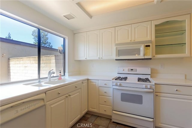 227 Gable Ln, La Habra, CA 90631 - kitchen featuring white appliances, light countertops, white cabinets, and glass insert cabinets