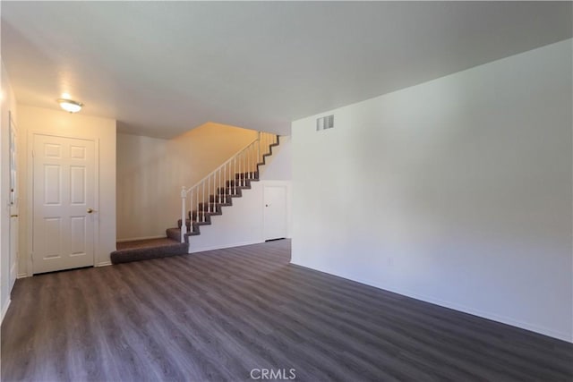 227 Gable Ln, La Habra, CA 90631 - unfurnished living room featuring dark wood-style floors and stairs