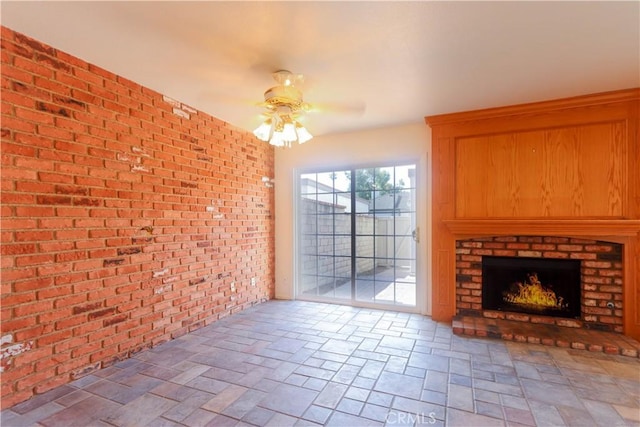 227 Gable Ln, La Habra, CA 90631 - unfurnished living room with a ceiling fan, brick wall, and a fireplace