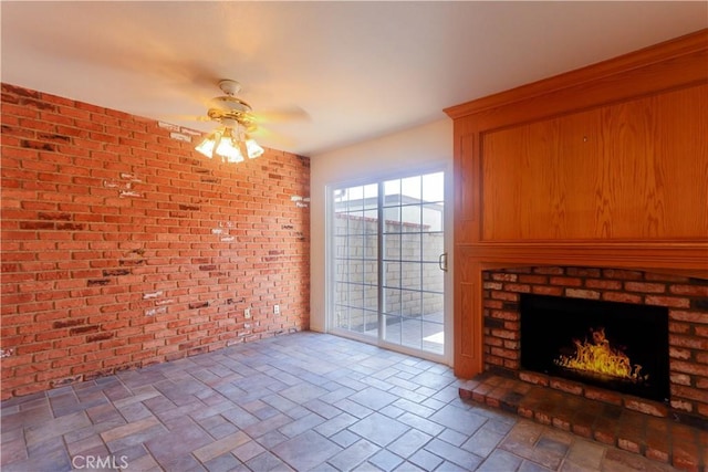 227 Gable Ln, La Habra, CA 90631 - unfurnished living room featuring a ceiling fan, brick wall, and a fireplace