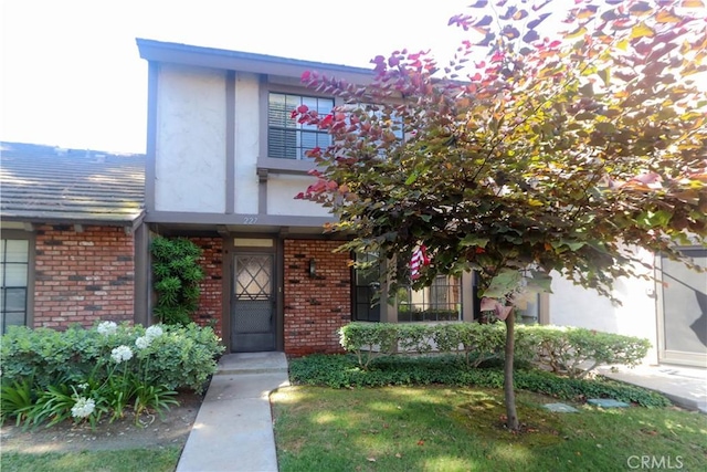 227 Gable Ln, La Habra, CA 90631 - view of front of home featuring brick siding and stucco siding