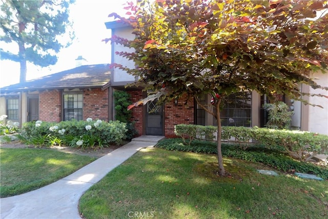 227 Gable Ln, La Habra, CA 90631 - view of front facade featuring brick siding and a front yard