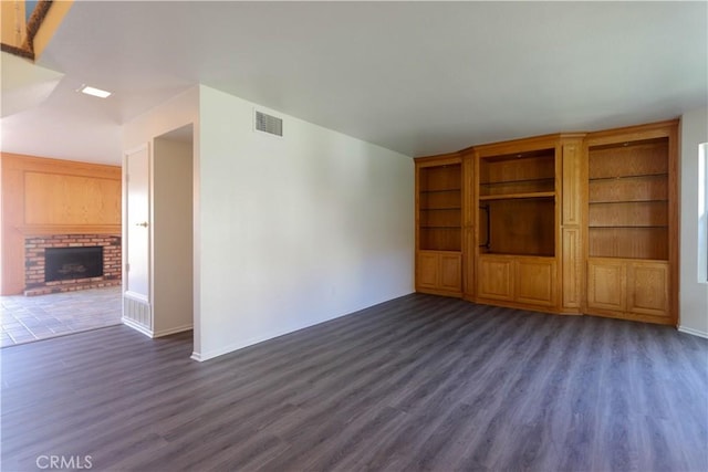 227 Gable Ln, La Habra, CA 90631 - unfurnished living room featuring dark wood-style floors and a fireplace