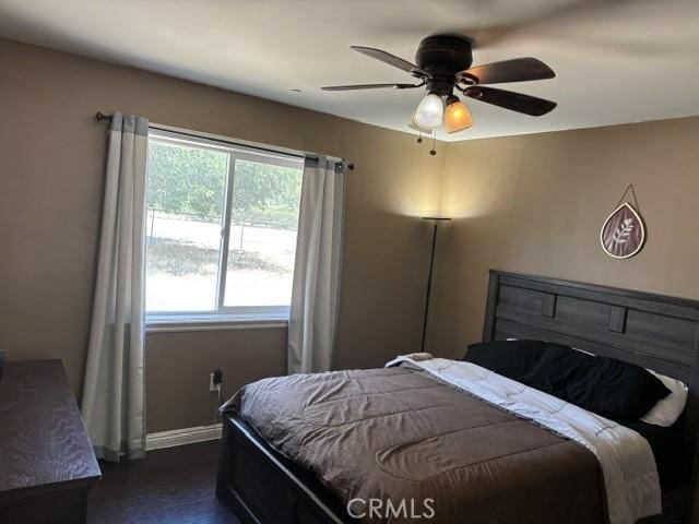 10401 Hemlock Ave, Hesperia, CA 92345 - bedroom featuring ceiling fan and dark wood-type flooring