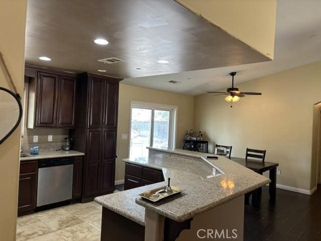 10401 Hemlock Ave, Hesperia, CA 92345 - kitchen with dishwasher, dark brown cabinets, a large island with sink, a breakfast bar, and recessed lighting