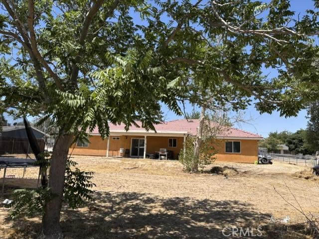 10401 Hemlock Ave, Hesperia, CA 92345 - rear view of property featuring stucco siding and a tile roof