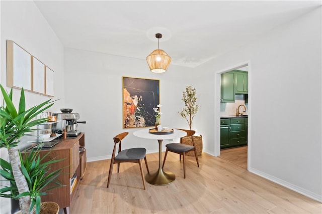625 N Flores St Unit 202, West Hollywood, CA 90048 - dining area with light wood-style flooring and baseboards