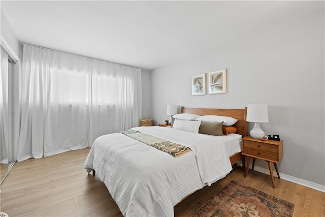 625 N Flores St Unit 202, West Hollywood, CA 90048 - bedroom with wood finished floors and baseboards