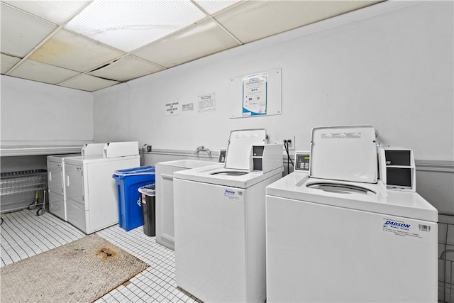 625 N Flores St Unit 202, West Hollywood, CA 90048 - shared laundry room with washer and dryer and light tile patterned floors