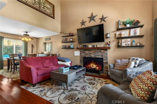 2566 Cottonwood Trl, Chino Hills, CA 91709 - living area featuring wood finished floors, ceiling fan, and a fireplace