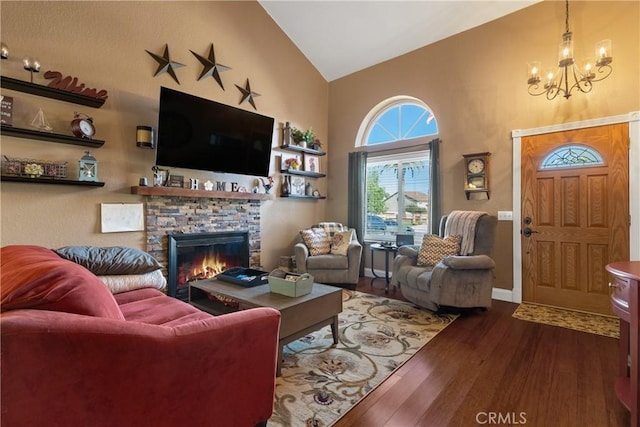 2566 Cottonwood Trl, Chino Hills, CA 91709 - living room featuring a chandelier, hardwood / wood-style flooring, high vaulted ceiling, and a fireplace