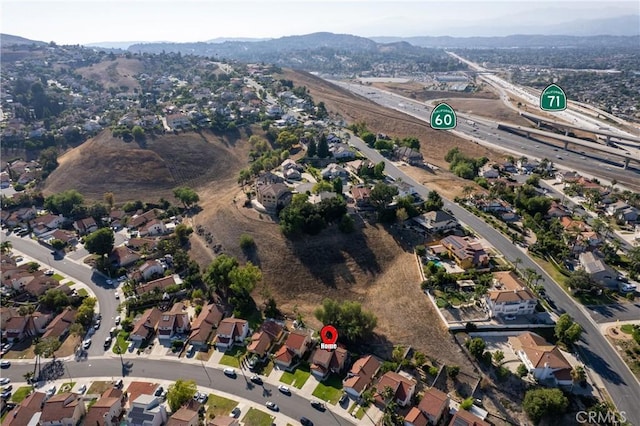 2566 Cottonwood Trl, Chino Hills, CA 91709 - aerial overview of property's location with a mountainous background and nearby suburban area