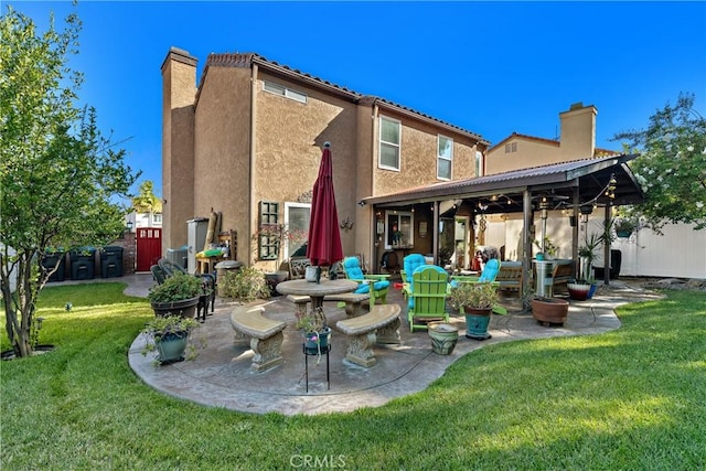 2566 Cottonwood Trl, Chino Hills, CA 91709 - back of property featuring a patio, stucco siding, and a chimney