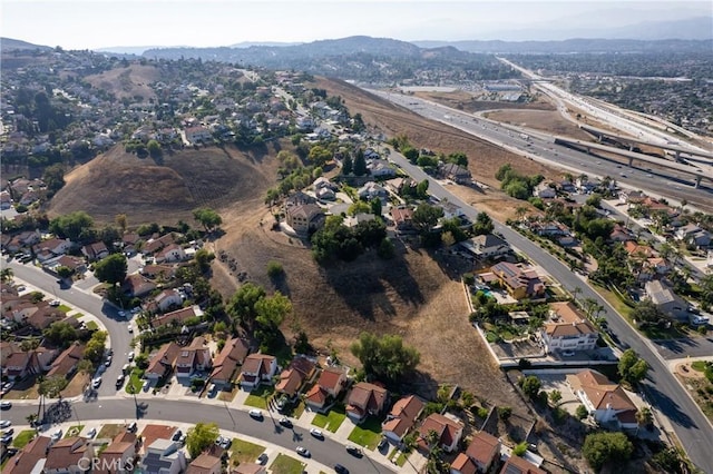 2566 Cottonwood Trl, Chino Hills, CA 91709 - aerial view of property and surrounding area featuring a mountain backdrop and nearby suburban area
