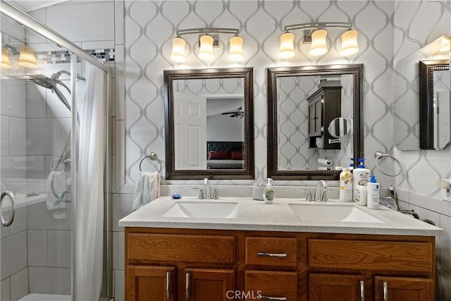 2566 Cottonwood Trl, Chino Hills, CA 91709 - bathroom with wallpapered walls, a shower stall, and double vanity