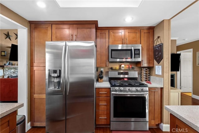 2566 Cottonwood Trl, Chino Hills, CA 91709 - kitchen featuring stainless steel appliances, brown cabinets, light countertops, and recessed lighting