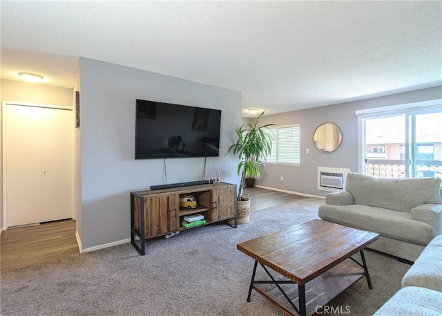 12200 Montecito Rd Unit D320, Seal Beach, CA 90740 - carpeted living area with baseboards and a wall unit AC
