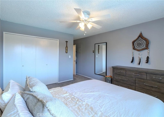 12200 Montecito Rd Unit D320, Seal Beach, CA 90740 - carpeted bedroom with a closet, a textured ceiling, and a ceiling fan