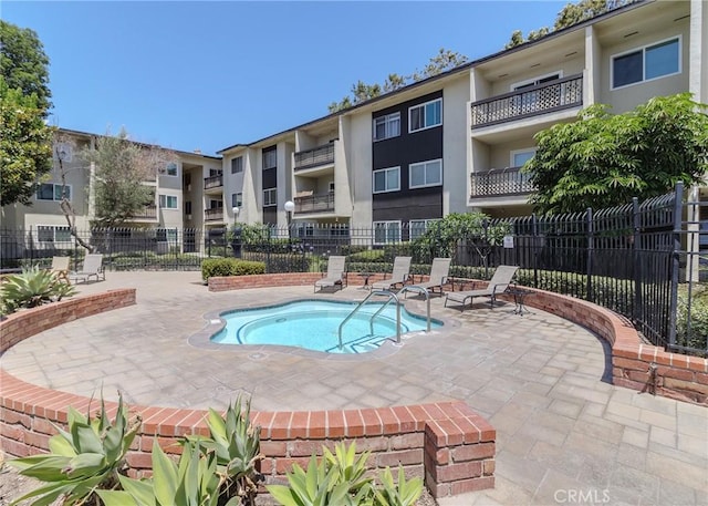 12200 Montecito Rd Unit D320, Seal Beach, CA 90740 - view of swimming pool with a community hot tub, a swimming pool, and a patio area