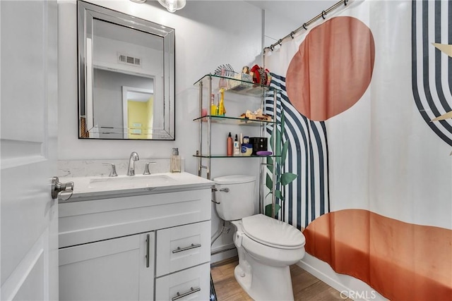 3609 S Parton St, Santa Ana, CA 92707 - bathroom with vanity, a shower with shower curtain, and wood finished floors