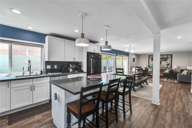3609 S Parton St, Santa Ana, CA 92707 - kitchen featuring freestanding refrigerator, dark countertops, dark wood-style floors, hanging light fixtures, and recessed lighting
