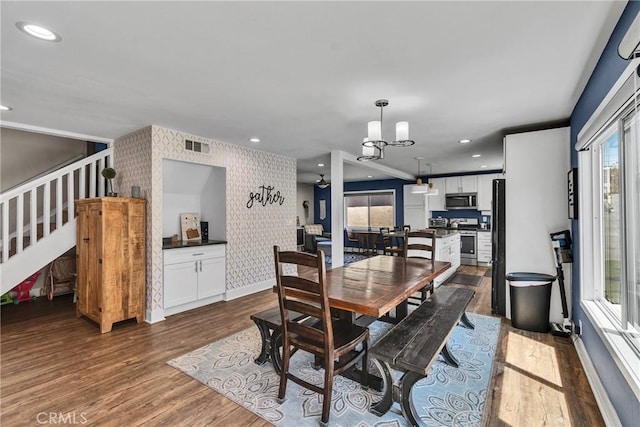 3609 S Parton St, Santa Ana, CA 92707 - dining room with plenty of natural light, wallpapered walls, an accent wall, dark wood finished floors, and recessed lighting