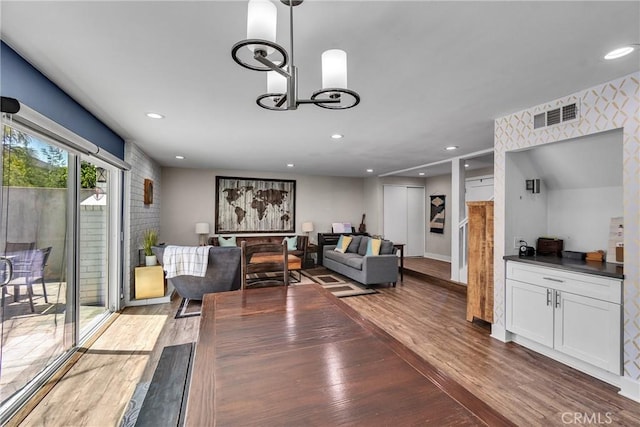 3609 S Parton St, Santa Ana, CA 92707 - living room with wood finished floors, recessed lighting, and a chandelier