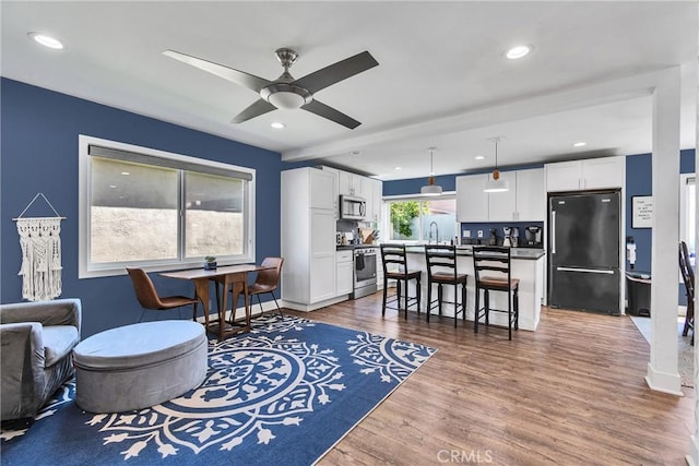 3609 S Parton St, Santa Ana, CA 92707 - living area featuring ceiling fan, wood finished floors, and recessed lighting